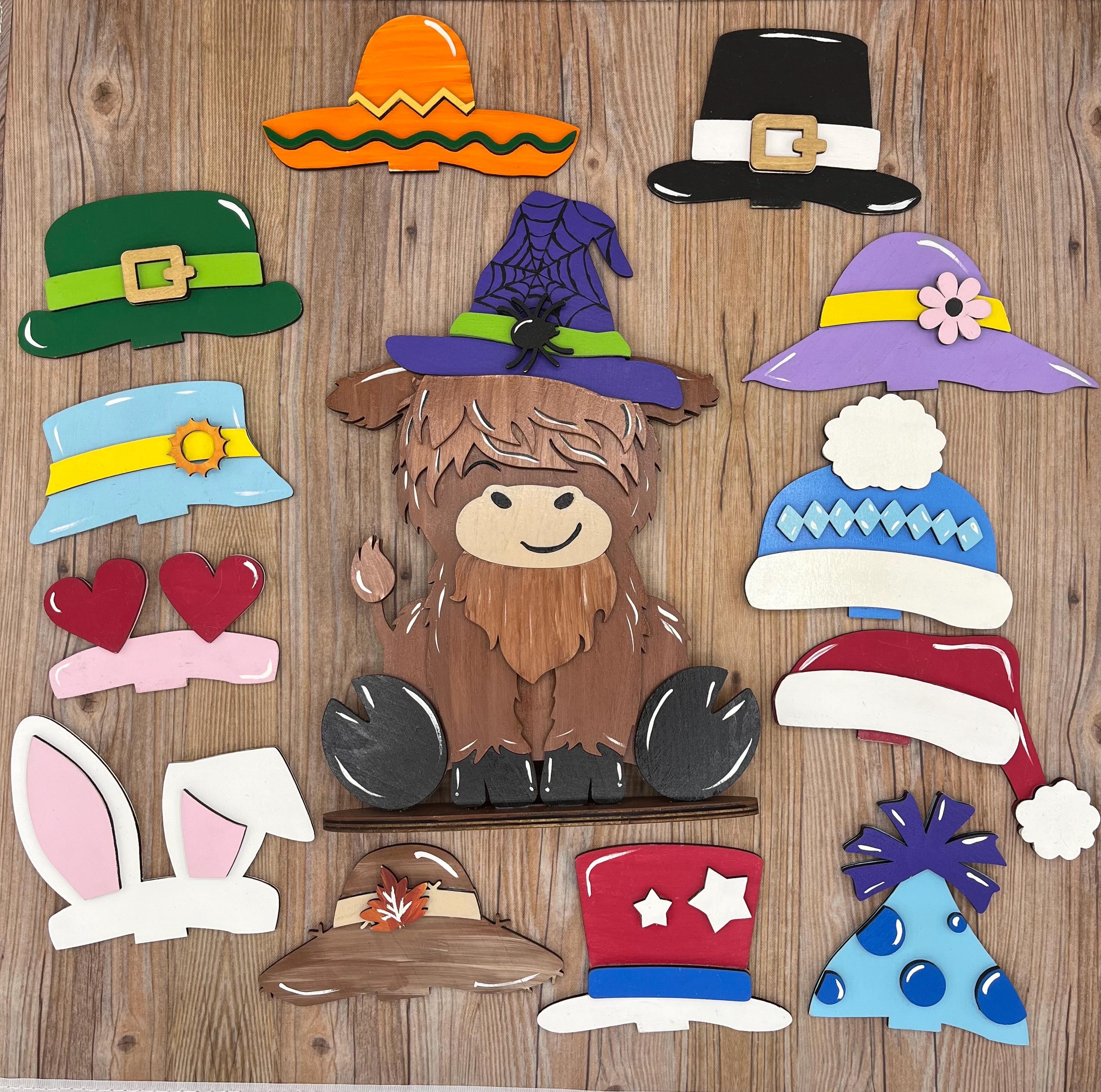 Cute Highland Cow Desk Buddy with Interchangeable Seasonal Hats