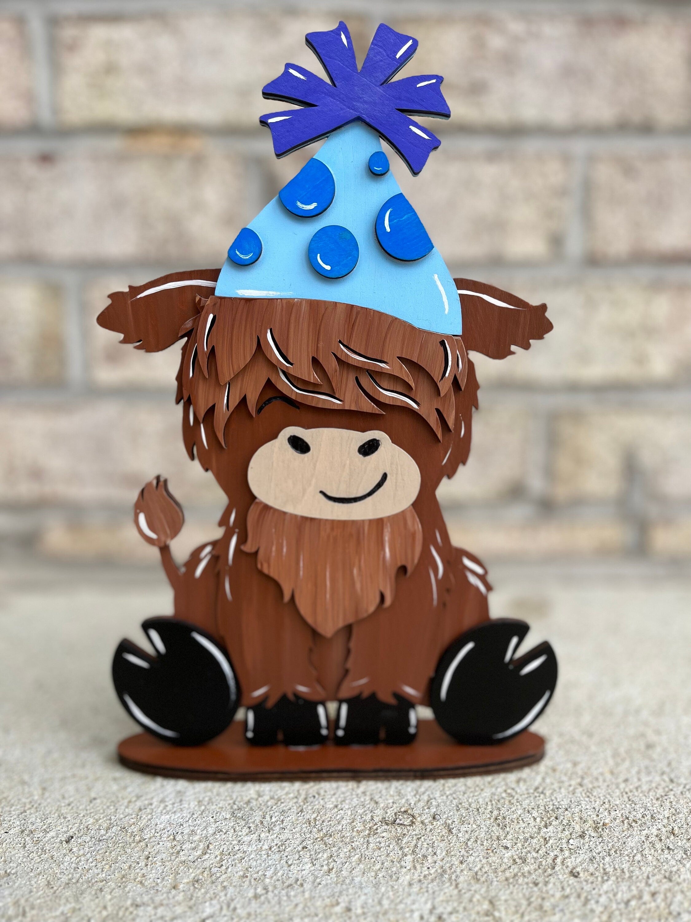 Cute Highland Cow Desk Buddy with Interchangeable Seasonal Hats