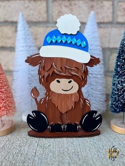 Holiday Highland Cow Shelf Table Desk Sitter with Interchangeable Seasonal Hats
