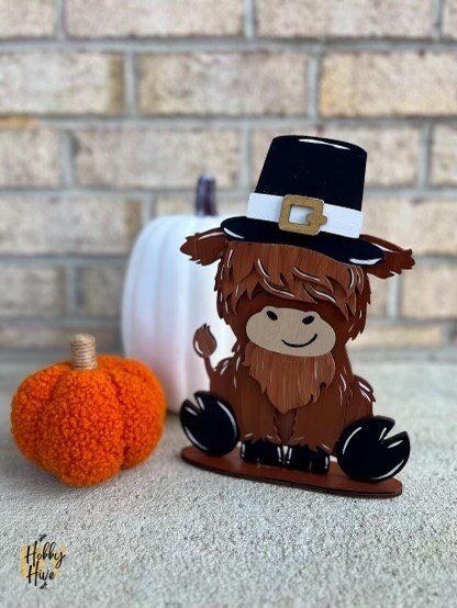 Cute Highland Cow Desk Buddy with Interchangeable Seasonal Hats