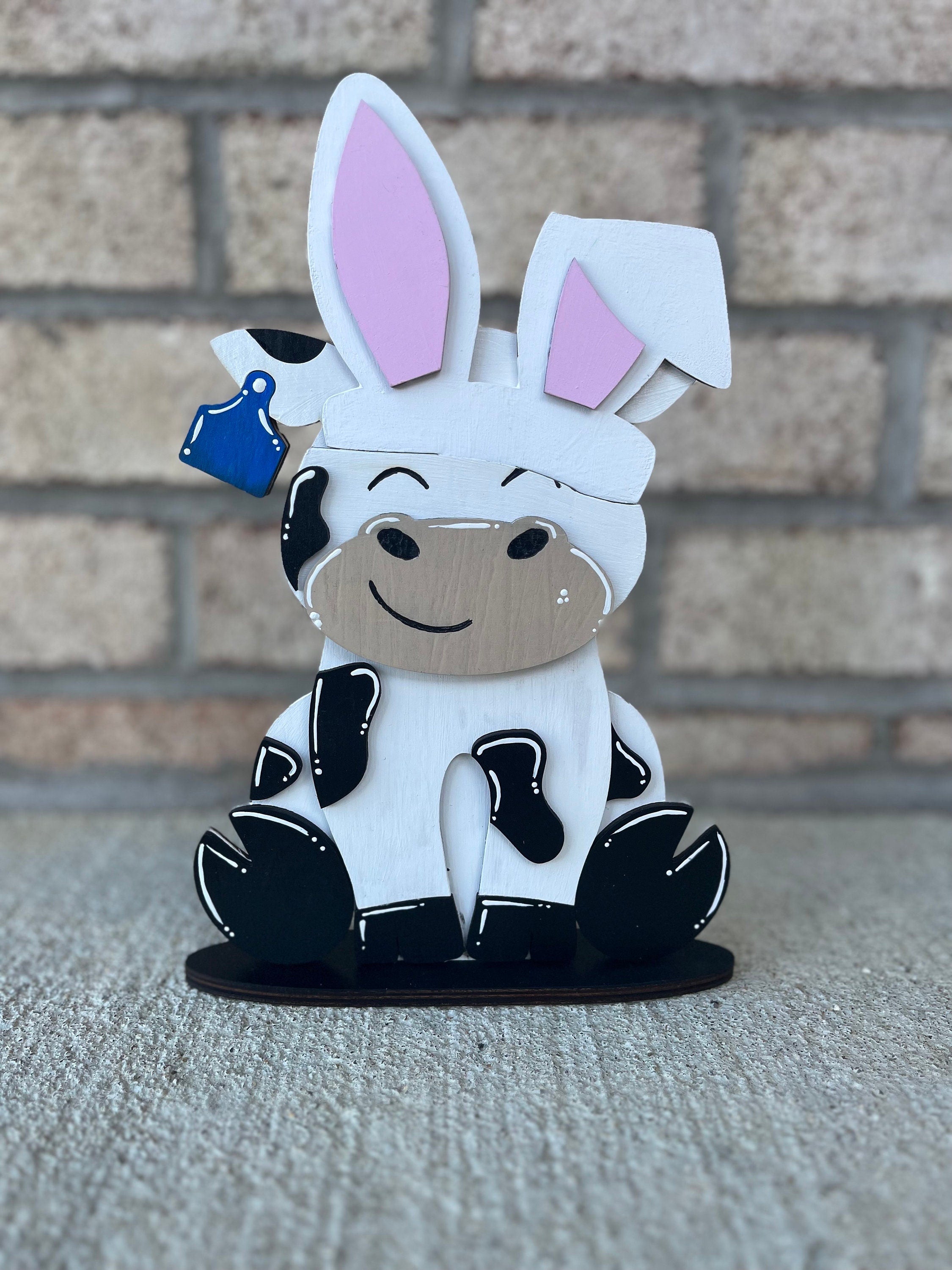 Dairy Cow Interchangeable Desk Buddy with 13 Seasonal and Holiday Hats