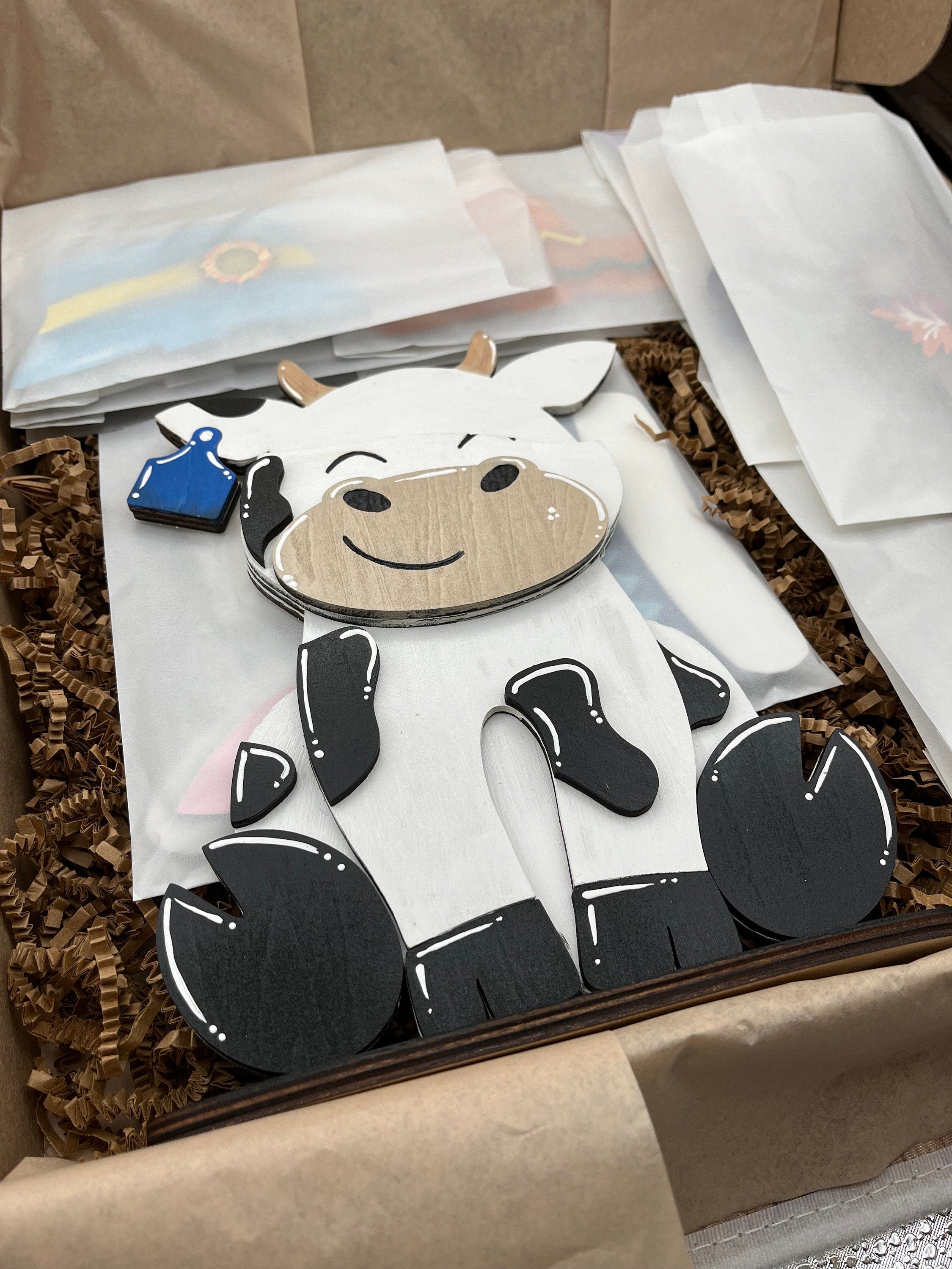 Dairy Cow Interchangeable Desk Buddy with 13 Seasonal and Holiday Hats