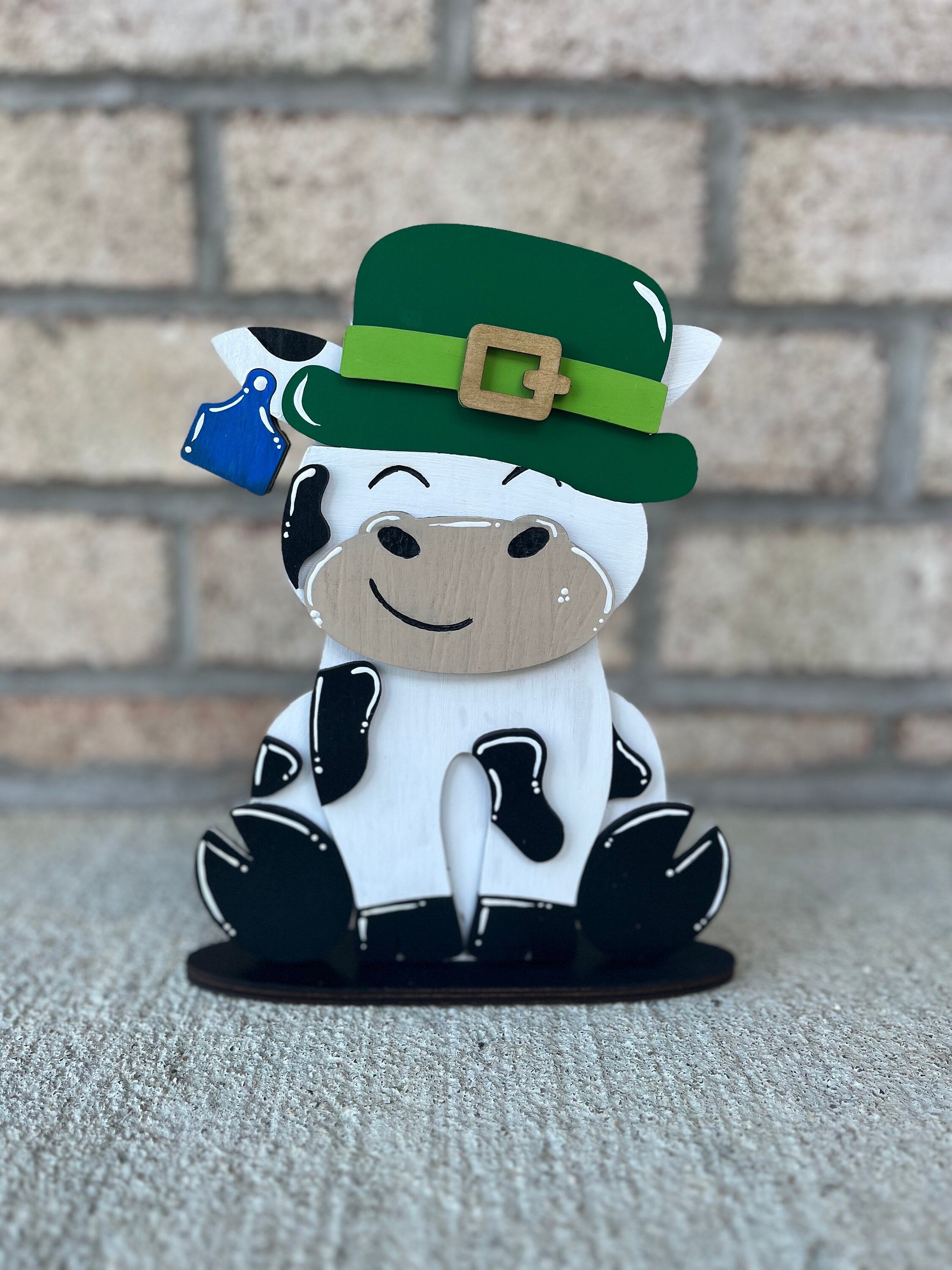 Dairy Cow Interchangeable Desk Buddy with 13 Seasonal and Holiday Hats